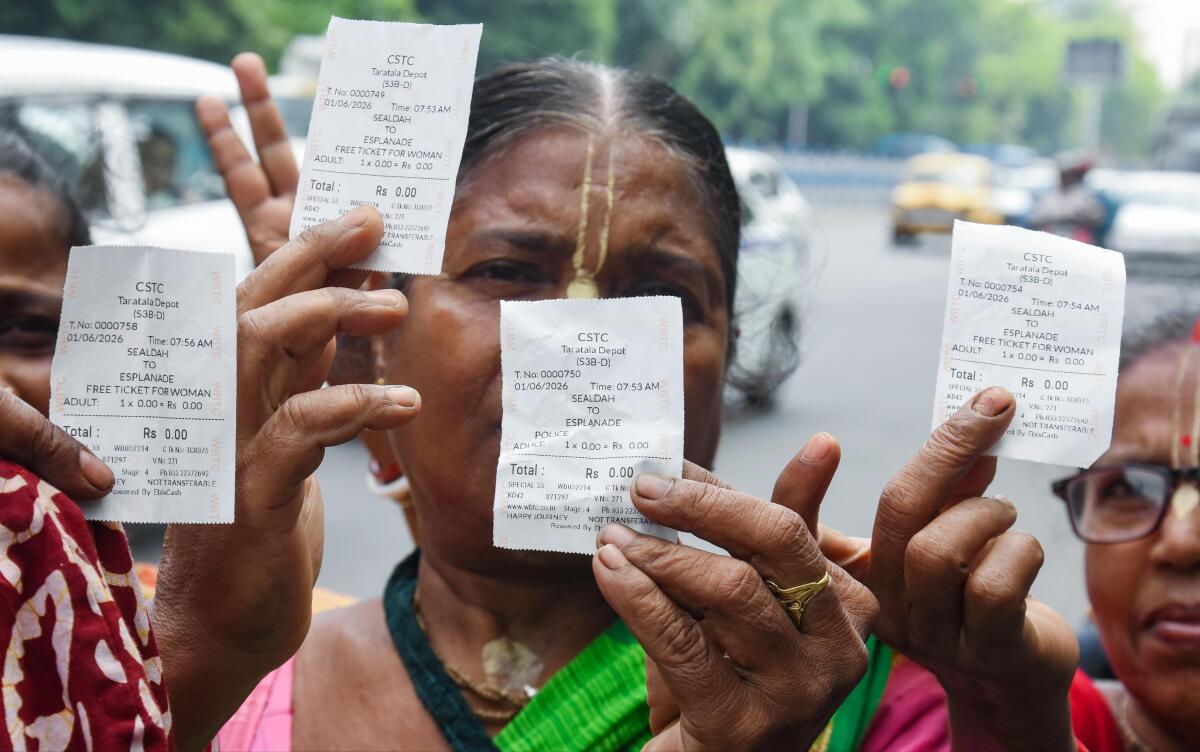 Passengers show their free tickets in a West Bengal in June 2026.
